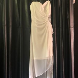 All white dress with detailed jewels on the side.